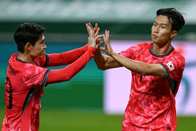 South Korea's Eom Ji-sung (R) celebrates his goal against Paraguay during a friendly football match between South Korea and Paraguay in Seoul on October 14, 2025. (Photo by Jung Yeon-je / AFP)