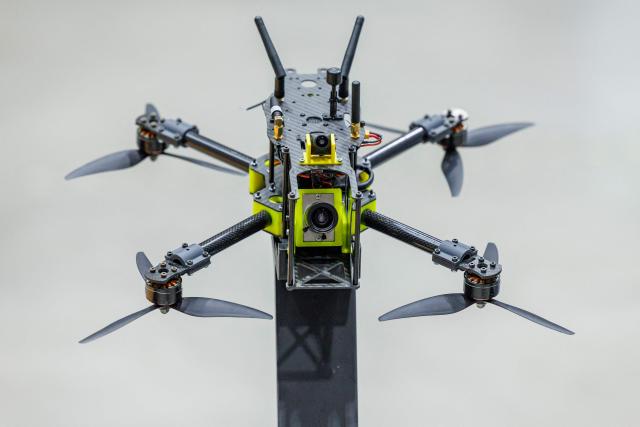 (FILES) A so-called hunter drone is seen at the National Test Centre for Unmanned Aerial Systems of the German Aerospace Centre (DLR) as part of a presentation of the ‘CUSTODIAN’ programme for drone defence in Cochstedt, eastern Germany on October 8, 2025. Once holidaymakers took off from here, but today an ex-Soviet airfield is a testing ground for ways to take down the drones increasingly buzzing through German skies. Germany has been rattled by a spate of mysterious sightings of unmanned aerial vehicles (UAVs), believed to be from Russia, over military bases, industrial sites and an airport. But at the airstrip near the eastern city of Magdeburg, researchers of the German Aerospace Center (DLR) have been testing more subtle options to deal with potentially hostile drones. (Photo by JENS SCHLUETER / AFP)
