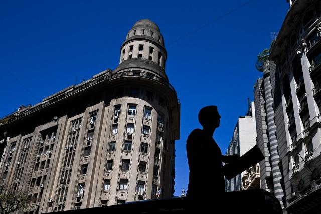 A man walks in downtown Buenos Aires on October 14, 2025. Argentina's statistics agency INDEC is expected to announce September’s inflation rate later in the day. (Photo by Luis ROBAYO / AFP)