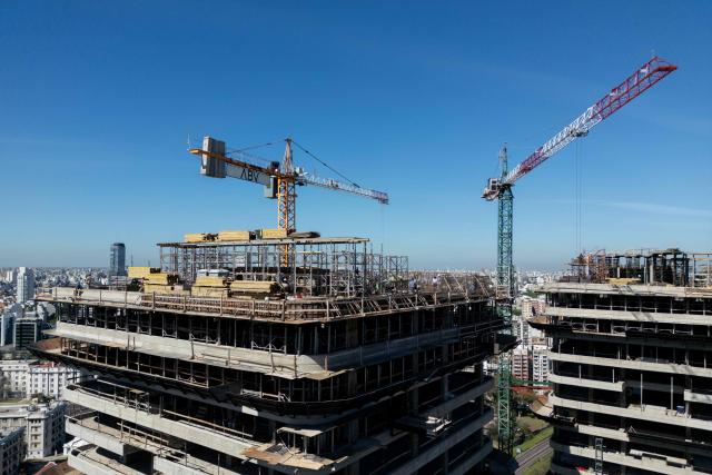 Aerial view of buildings under construction in Buenos Aires taken on October 14, 2025. Argentina's statistics agency INDEC is expected to announce September’s inflation rate later in the day. (Photo by Luis ROBAYO / AFP)