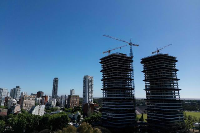 Aerial view of buildings under construction in Buenos Aires taken on October 14, 2025. Argentina's statistics agency INDEC is expected to announce September’s inflation rate later in the day. (Photo by Luis ROBAYO / AFP)
