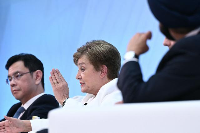 IMF Managing Director Kristalina Georgieva (C) speaks during a seminar titled "The Future of Finance" during the IMF/World Bank annual meetings in Washington, DC on October 14, 2025. (Photo by Brendan SMIALOWSKI / AFP)