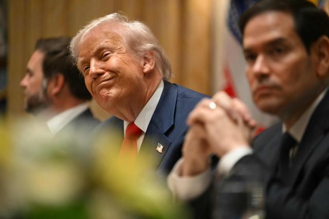 US President Donald Trump (C) smiles next to Vice President JD Vance (L) and Secretary of State Marco Rubio as they meet with Argentina's President Javier Milei in the Cabinet Room at the White House in Washington, DC, on October 14, 2025. (Photo by ANDREW CABALLERO-REYNOLDS / AFP)
