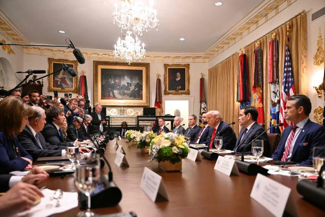 US President Donald Trump (3rd R) meets with Argentina's President Javier Milei (3rd L) in the Cabinet Room at the White House in Washington, DC, on October 14, 2025. (Photo by ANDREW CABALLERO-REYNOLDS / AFP)