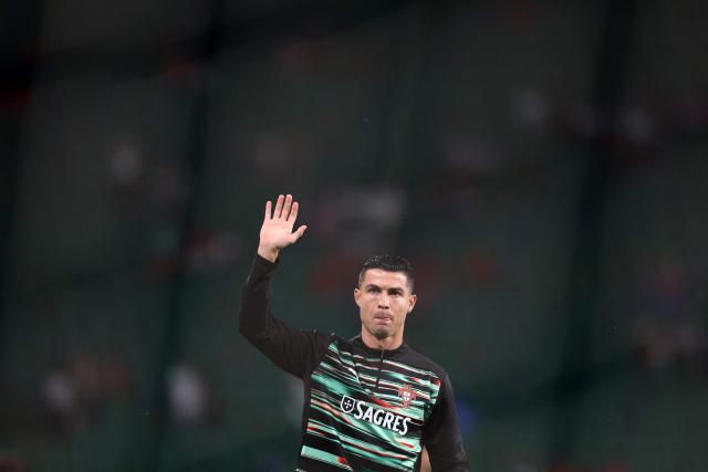 Portugal's forward #16 Cristiano Ronaldo acknowledges supporters during warm-up ahead of the 2026 World Cup qualifiers Europe zone group F football match between Portugal and Hungary at Jose Alvalade stadium in Lisbon on October 14, 2025. (Photo by PATRICIA DE MELO MOREIRA / AFP)