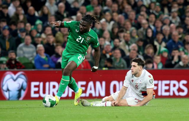 Republic of Ireland's defender #21 Festy Ebosele is tackled by Armenia's defender #05 Styopa Mkrtchyan during the 2026 World Cup Group F qualifier football match between Republic of Ireland and Armenia, at Aviva Stadium, in Dublin, on October 14, 2025. (Photo by Paul Faith / AFP)