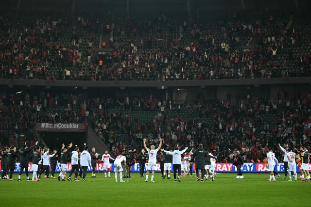 Turkey’s players celebrate their victory at the end of the FIFA World Cup 2026 Group E European qualification football match between Turkey and Georgia at the Kocaeli Stadium, in Kocaeli, on October 14, 2025. (Photo by OZAN KOSE / AFP)