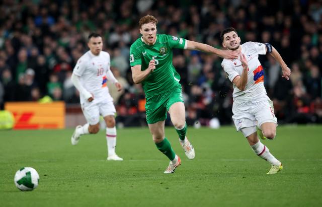 Republic of Ireland's defender #05 Jake O'Brien battles for the ball with Armenia's midfielder #08 Eduard Spertsyan during the 2026 World Cup Group F qualifier football match between Republic of Ireland and Armenia, at Aviva Stadium, in Dublin, on October 14, 2025. (Photo by Paul Faith / AFP)