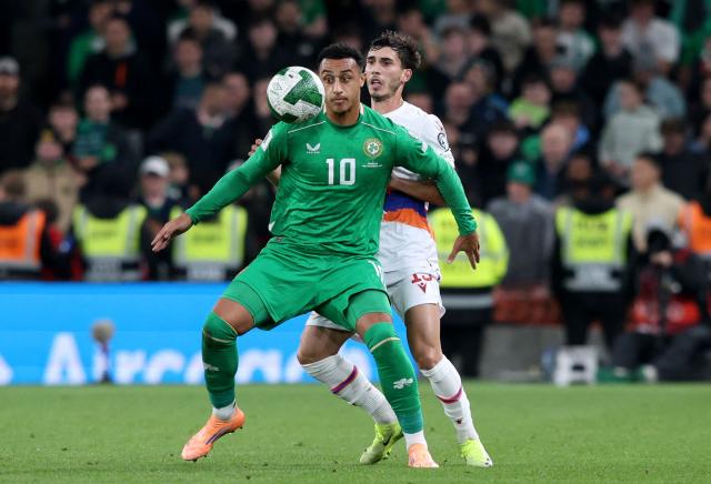 Republic of Ireland's striker #10 Adam Idah battles for the ball with Armenia's defender #19 Edgar Grigoryan during the 2026 World Cup Group F qualifier football match between Republic of Ireland and Armenia, at Aviva Stadium, in Dublin, on October 14, 2025. (Photo by Paul Faith / AFP)