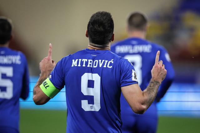Serbia's forward #09 Aleksandar Mitrovic celebrates after scoring Serbia's third goal from the penalty spot during the FIFA World Cup 2026 Group K European qualification football match between Andorra and Serbia, at the New FAF Stadium in Encamp, on October 14, 2025. (Photo by Valentine CHAPUIS / AFP)