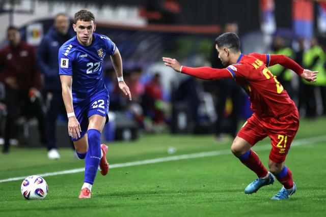 Serbia's defender #22 Stefan Mitrovic (L) runs with the ball during the FIFA World Cup 2026 Group K European qualification football match between Andorra and Serbia, at the New FAF Stadium in Encamp, on October 14, 2025. (Photo by Valentine CHAPUIS / AFP)