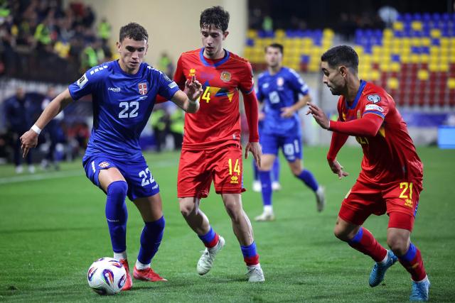 Serbia's defender #22 Stefan Mitrovic (L) runs with the ball during the FIFA World Cup 2026 Group K European qualification football match between Andorra and Serbia, at the New FAF Stadium in Encamp, on October 14, 2025. (Photo by Valentine CHAPUIS / AFP)