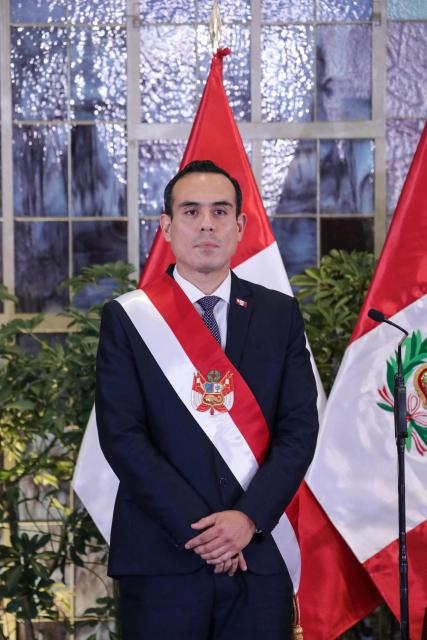 Peru's interim President Jose Jeri looks on during the inauguration ceremony of his cabinet at the Presidential Palace in Lima on October 13, 2025. Peru's new interim president, José Jerí, appointed a retired general who fought against the Shining Path guerrilla group as interior minister on Tuesday, one of the key positions in the transitional government. (Photo by CONNIE FRANCE / AFP)