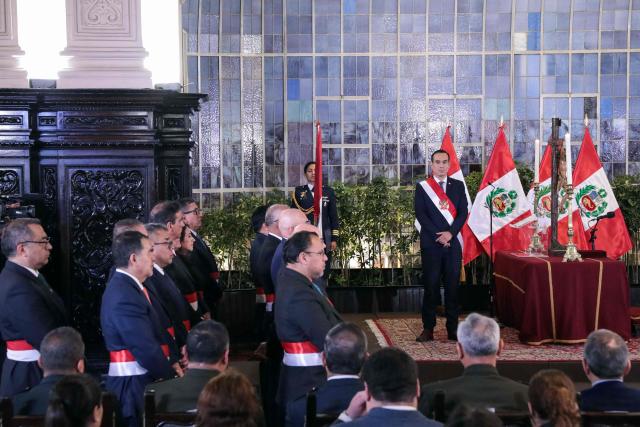 Peru's interim President Jose Jeri (R) looks on during the inauguration ceremony of his cabinet at the Presidential Palace in Lima on October 13, 2025. Peru's new interim president, José Jerí, appointed a retired general who fought against the Shining Path guerrilla group as interior minister on Tuesday, one of the key positions in the transitional government. (Photo by CONNIE FRANCE / AFP)