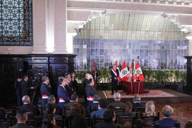Peru's interim President Jose Jeri (R) looks on during the inauguration ceremony of his cabinet at the Presidential Palace in Lima on October 13, 2025. Peru's new interim president, José Jerí, appointed a retired general who fought against the Shining Path guerrilla group as interior minister on Tuesday, one of the key positions in the transitional government. (Photo by CONNIE FRANCE / AFP)