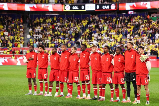Canada's line up for the national anthems ahead of the international friendly football match between Canada and Colombia at Sports Illustrated Stadium in Harrison, New Jersey, on October 14, 2025. (Photo by CHARLY TRIBALLEAU / AFP)