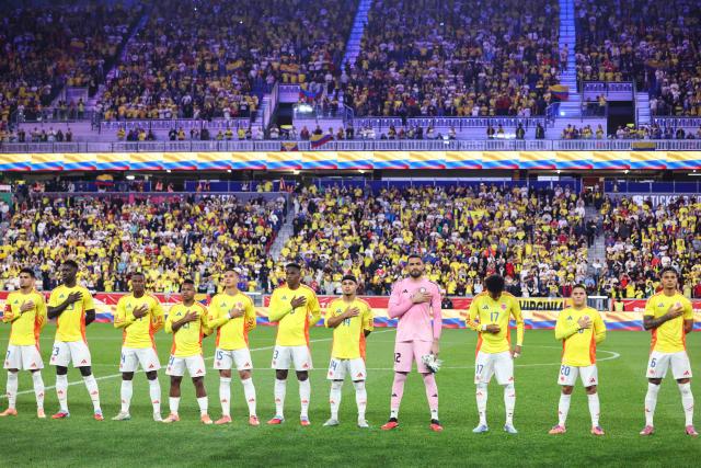 Colombia's line up for the national anthems ahead of the international friendly football match between Canada and Colombia at Sports Illustrated Stadium in Harrison, New Jersey, on October 14, 2025. (Photo by CHARLY TRIBALLEAU / AFP)