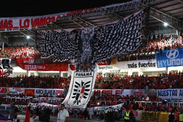 Fans of Panama display a giant eagle as they cheer for their team before the 2026 FIFA World Cup Concacaf qualifier football match between Panama and Suriname at the Rommel Fernandez Gutierrez Stadium in Panama City on October 14, 2025. (Photo by ARIS MARTINEZ / AFP)