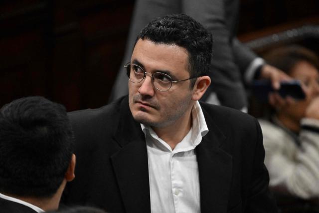 Guatemalan deputy Samuel Perez looks on during a session where they might review and approve an anti-gang law at the National Congress in Guatemala City on October 14, 2025. Twenty members of a gang designated a "foreign terrorist organization" by the United States have escaped from detention in Guatemala, a prison chief said Sunday. (Photo by JOHAN ORDONEZ / AFP)