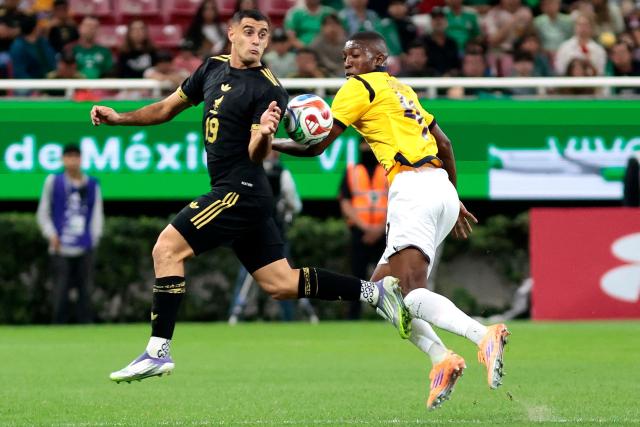 Mexico's forward #19 German Berterame and Ecuador's defender #04 Joel Ordonez fight for the ball during the international friendly match between Mexico and Ecuador at the Akron Stadium in Zapopan, Jalisco state, Mexico on October 14, 2025. (Photo by Ulises Ruiz / AFP)