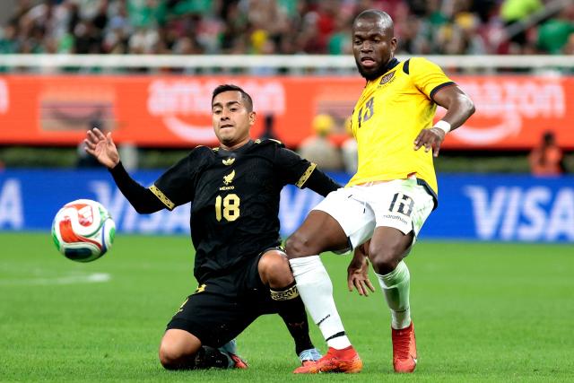 Mexico's midfielder #18 Erick Sanchez and Ecuador's forward #13 Enner Valencia fight for the ball during the international friendly match between Mexico and Ecuador at the Akron Stadium in Zapopan, Jalisco state, Mexico on October 14, 2025. (Photo by Ulises Ruiz / AFP)