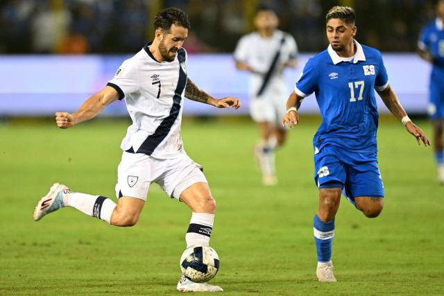 Guatemala's defender #07 Aaron Herrera and El Salvador's midfielder #17 Jairo Henriquez fight for the ball during the 2026 FIFA World Cup Concacaf qualifier football match between El Salvador and Guatemala at the Cuscatlan Stadium in San Salvador on October 14, 2025. (Photo by MARVIN RECINOS / AFP)