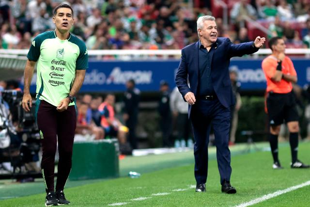 Mexico's assistant coach Rafael Marquez gestures next to Mexico's coach Javier Aguirre during the international friendly match between Mexico and Ecuador at the Akron Stadium in Zapopan, Jalisco state, Mexico on October 14, 2025. (Photo by Ulises Ruiz / AFP)