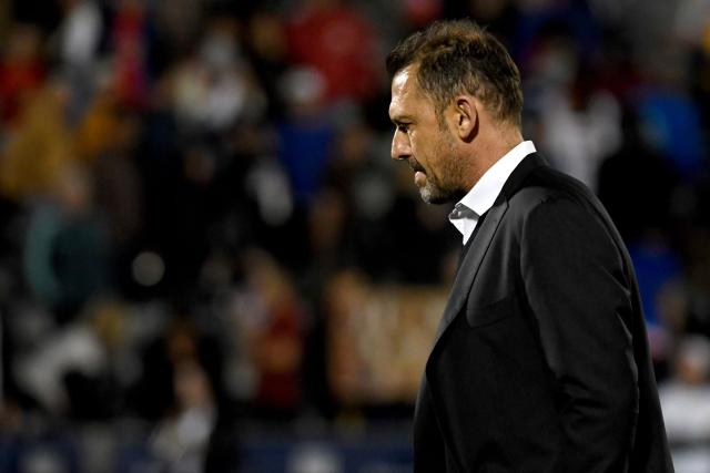 Australia's head coach Tony Popovic walks off of the pitch after Australia was defeated by the USA during the international friendly football match between USA and Australia at Dick's Sporting Goods Park in Commerce City, Colorado, on October 14, 2025. (Photo by Jason Connolly / AFP)