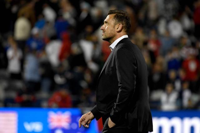 Australia's head coach Tony Popovic walks off of the pitch after Australia was defeated by the USA during the international friendly football match between USA and Australia at Dick's Sporting Goods Park in Commerce City, Colorado, on October 14, 2025. (Photo by Jason Connolly / AFP)