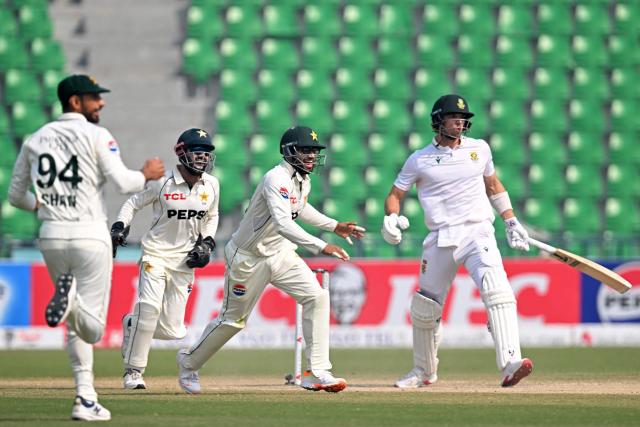 Pakistan's players celebrates after the dismissal of South Africa's Tristan Stubbs (R) during the fourth day of the first Test cricket match between Pakistan and South Africa at the Gaddafi Stadium in Lahore on October 15, 2025. (Photo by Aamir QURESHI / AFP)