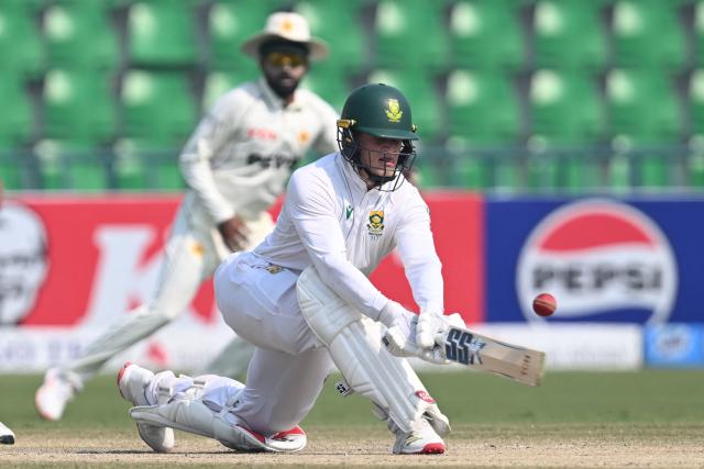 South Africa's Ryan Rickelton plays a shot during the fourth day of the first Test cricket match between Pakistan and South Africa at the Gaddafi Stadium in Lahore on October 15, 2025. (Photo by Aamir QURESHI / AFP)