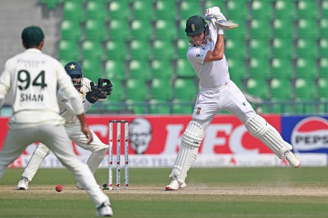 South Africa's Dewald Brevis (R) plays a shot during the fourth day of the first Test cricket match between Pakistan and South Africa at the Gaddafi Stadium in Lahore on October 15, 2025. (Photo by Aamir QURESHI / AFP)
