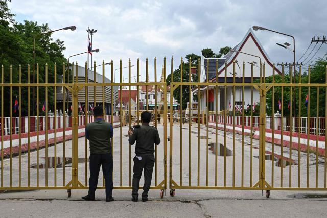 (FILES) Cambodian police officials stand next to the closed gate at Poipet International border checkpoint between Cambodia-Thailand, at Poipet town in Banteay Meanchey province on June 24, 2025. South Korea on October 15, 2025 imposed travel bans on parts of Cambodia with South Korea shaken by the torture and killing of a college student there.
"The Bokor Mountain area in Kampot Province, Bavet City, and Poipet City are designated as travel ban zones," the foreign ministry said in a statement. (Photo by TANG CHHIN Sothy / AFP)