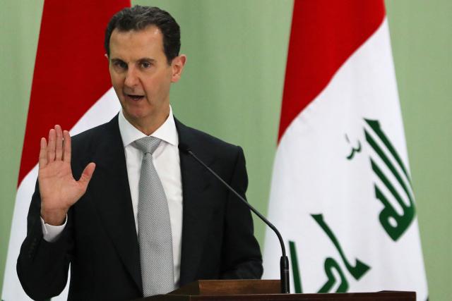 (FILES) Syria's President Bashar al-Assad speaks during a press conference with Iraq's Prime Minister in Damascus on July 16, 2023. Syrian interim president Ahmed al-Sharaa will ask Russia to hand over former ruler Bashar al-Assad during his first visit to Moscow on October 15, 2025, a government official said. (Photo by LOUAI BESHARA / AFP)
