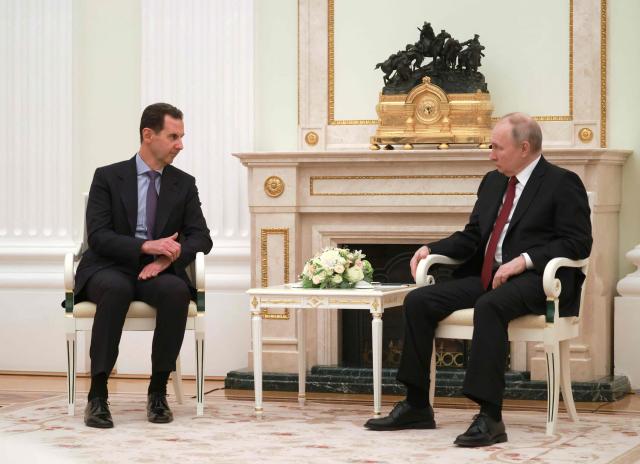 (FILES) Russian President Vladimir Putin (R) meets with his Syrian counterpart Bashar al-Assad at the Kremlin in Moscow on March 15, 2023. Syrian interim president Ahmed al-Sharaa will ask Russia to hand over former ruler Bashar al-Assad during his first visit to Moscow on October 15, 2025, a government official said. (Photo by Vladimir GERDO / SPUTNIK / AFP)