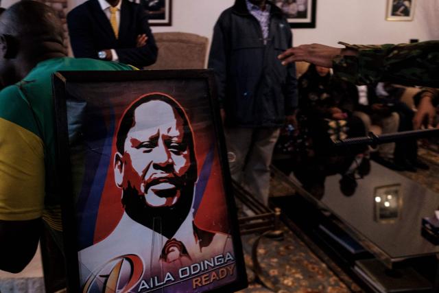 Kenyan Police officers removes supporters of Kenyan opposition leader Raila Odinga from his official residence in the Karen neighbourhood of Nairobi on October 15, 2025 as they demand information before the death of Raila Odinga was announced. Kenyan opposition leader Raila Odinga has died at the age of 80 during a health visit to India, local police said on October 15, 2025.
Odinga was the perennial opposition figure of Kenyan politics, running unsuccessfully for the presidency on five occasions, most recently in 2022. 
He remained a dominant force, able to rally huge numbers, particularly from his native western Kenya. (Photo by Kabir Dhanji / AFP)