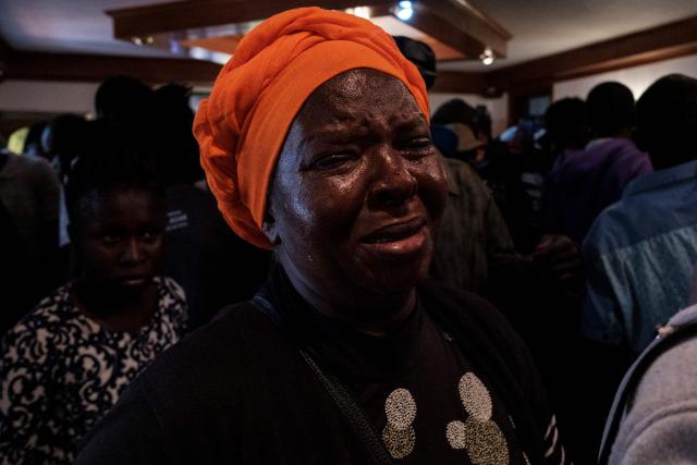 A supporter of Kenyan opposition leader Raila Odinga reacts at Odinga's official residence in the Karen neighbourhood of Nairobi on October 15, 2025 as they demand information before the death of Raila Odinga was announced. Kenyan opposition leader Raila Odinga has died at the age of 80 during a health visit to India, local police said on October 15, 2025.
Odinga was the perennial opposition figure of Kenyan politics, running unsuccessfully for the presidency on five occasions, most recently in 2022. 
He remained a dominant force, able to rally huge numbers, particularly from his native western Kenya. (Photo by Kabir Dhanji / AFP)
