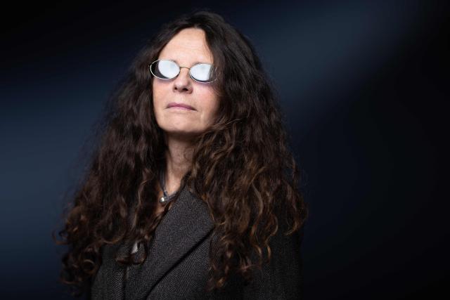French writer Catherine Girard, poses during a photo session in Paris on October 15, 2025. (Photo by JOEL SAGET / AFP)
