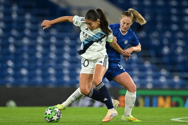 Chelsea's English midfielder #30 Keira Walsh (R) fouls Paris FC's French striker #10 Clara Mateo (L) during the UEFA Women's Champions League, league phase football match between Chelsea and Paris FC at Stamford Bridge in London on October 15, 2025. (Photo by JUSTIN TALLIS / AFP)