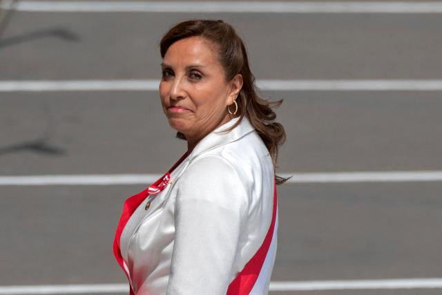 (FILES) Peruvian President Dina Boluarte arrives at the Congress building to give her annual Message to the Nation on Independence Day, in Lima on July 28, 2023. A Peruvian judge on October 15, 2025, declared "unfounded" the request of a prosecutor who sought to prevent former President Dina Boluarte, recently removed from office, from leaving the country while she is being investigated for alleged money laundering among other crimes. (Photo by Cris BOURONCLE / AFP)