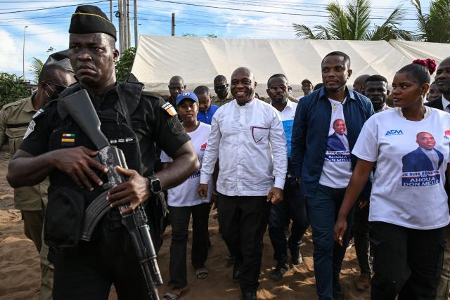 Independent presidential candidate Ahoua Don Mello arrives to attend his campaign rally at the commune of Port-Bouet in Abidjan on October 15, 2025. The west African nation will go to the polls on October 25 and incumbent Ouattara, in power since 2011, is vying for a fourth term in office. (Photo by Sia KAMBOU / AFP)