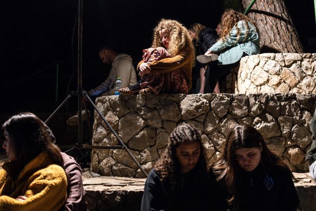 Friends and family gather during the hostage Daniel Peretz, after his body was returned from Gaza as part of a ceasefire agreement between Israel and Hamas, at the Mt. Herzl military cemetery in Jerusalem on October 15, 2025. (Photo by JOHN WESSELS / AFP)