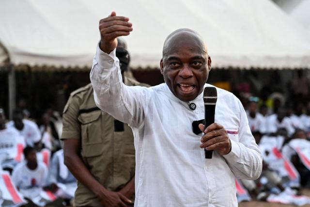 Ivorian independent presidential candidate Ahoua Don Mello delivers a speech during his campaign rally at the commune of Port-Bouet in Abidjan on October 15, 2025. The west African nation will go to the polls on October 25 and incumbent Ouattara, in power since 2011, is vying for a fourth term in office. (Photo by Sia KAMBOU / AFP)
