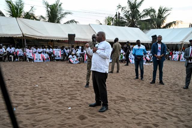 Ivorian independent presidential candidate Ahoua Don Mello delivers a speech during his campaign rally at the commune of Port-Bouet in Abidjan on October 15, 2025. The west African nation will go to the polls on October 25 and incumbent Ouattara, in power since 2011, is vying for a fourth term in office. (Photo by Sia KAMBOU / AFP)