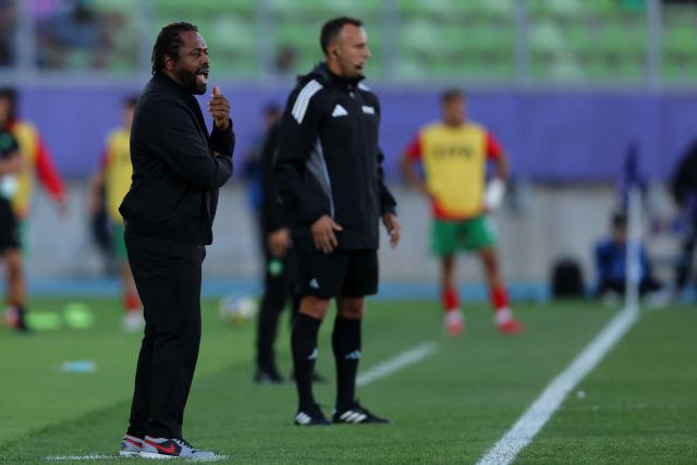 France's head coach Bernard Diomede (L) gives instructions during the 2025 FIFA U-20 World Cup semi-final football match between Morocco and France at the Elias Figueroa Stadium in Valparaiso, Chile on October 15, 2025. (Photo by Javier TORRES / AFP)