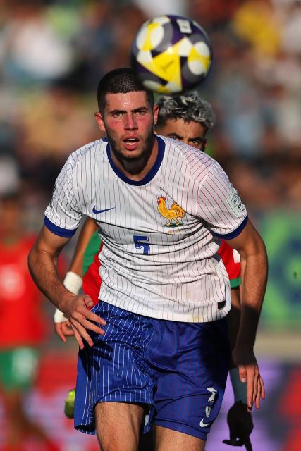 France's defender #05 Elyaz Zidane (front) and Morocco's forward #21 Yassir Zabiri eye the ball during the 2025 FIFA U-20 World Cup semi-final football match between Morocco and France at the Elias Figueroa Stadium in Valparaiso, Chile on October 15, 2025. (Photo by Javier TORRES / AFP)