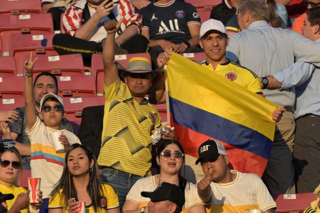 Fans of Colombia pose foro a picture ahead of the 2025 FIFA U-20 World Cup semi-final football match between Argentina and Colombia at the National Stadium in Santiago on October 15, 2025. (Photo by Rodrigo ARANGUA / AFP)