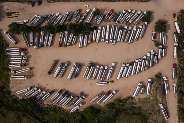 Aerial view of fuel tankers near a refinery in Santa Cruz, Bolivia on October 15, 2025. Bolivia will choose a president from among two right-wing candidates Sunday after two decades of socialist rule, with voters hoping for urgent measures to address foreign currency, fuel and food shortages. (Photo by Ernesto BENAVIDES / AFP)