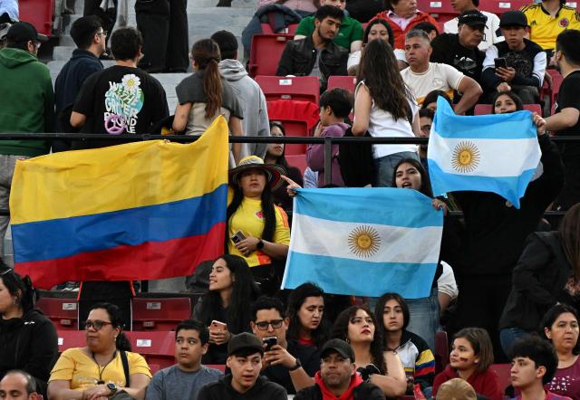 Colombian's and Argentina's fans attend during the 2025 FIFA U-20 World Cup semi-final football match between Argentina and Colombia at the National Stadium in Santiago on October 15, 2025. (Photo by RODRIGO ARANGUA / AFP)