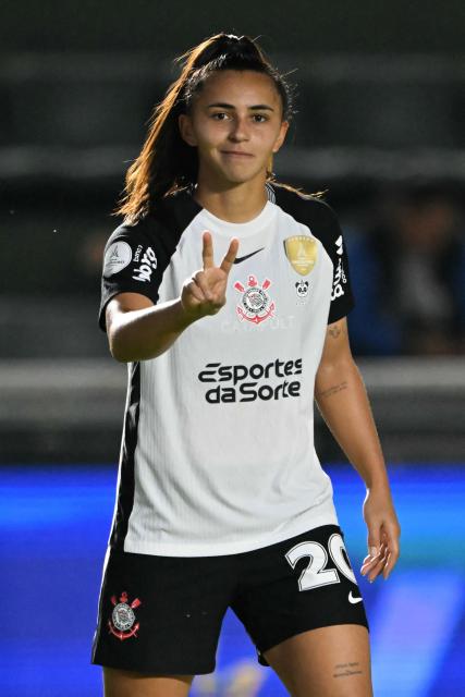 Corinthians' midfielder #20 Mariza celebrates scoring his team's first goal during the 2025 Women's Copa Libertadores quarter-final football match between Brazil's Corinthians and Brazil's Ferroviaria at the Florencio Sola Stadium in Banfield, Buenos Aires province on October 15, 2025. (Photo by Luis ROBAYO / AFP)